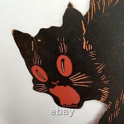 Carte découpée en carton noir avec des yeux orange de chat hurlant d'Halloween Dennison des années 1920, rare